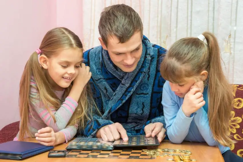 parent helps kids to collect coins